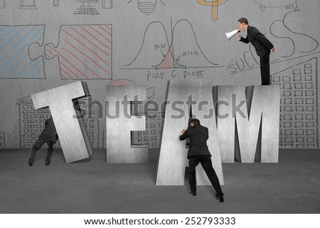 Businessman using megaphone commanding employees to move TEAM 3D concrete word together with doodles wall background