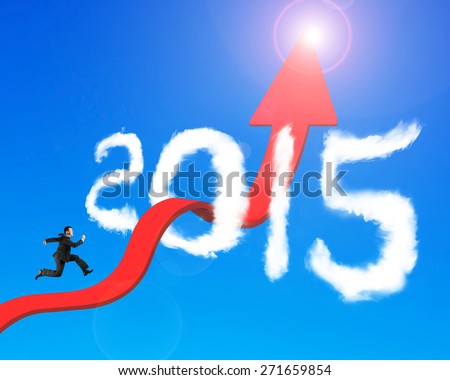 Businessman running on red arrow upward bending trend line breaking through 2015 shape clouds and blue sky sunlight background