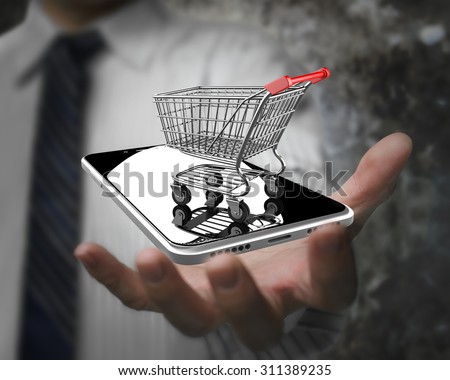 Businessman hand showing shopping cart with smart phone, on line shopping concept.