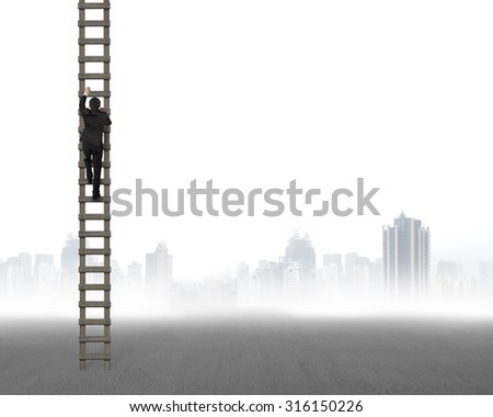 Rear view of businessman climbing on wooden ladder, on gray city skyline background.
