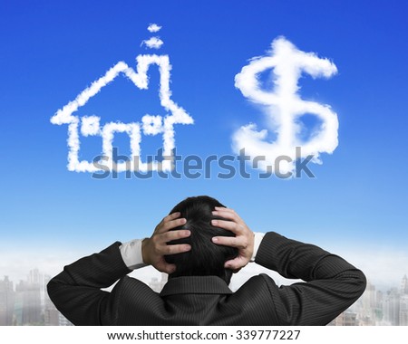 Dollar sign and house shape white clouds, with confused businessman hand holding head before making a choice.