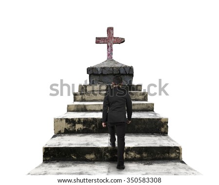 Man climbing on old concrete stairs to old cross, isolated on white background.