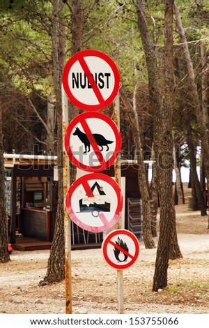 Signs prohibiting nudists, dogs, tents and campfires