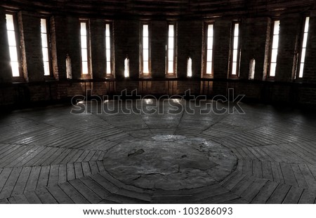Dark castle tower round room interior with glowing windows. Ancient fortress (Kremlin) in Smolensk town, Russia