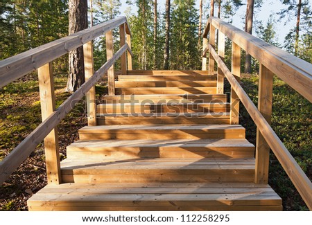 Wooden stairway goes up in the forest. Imatra town, Finland