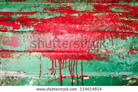 Small wooden boat hull under renovation. Background texture
