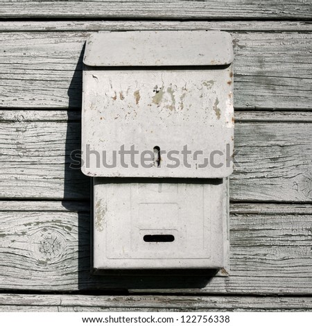 Traditional old mail box on the wooden wall
