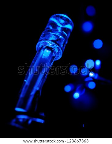 Closeup photo of blue LED (light emitting diodes) lights garland on black background