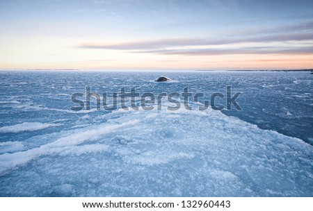 Winter landscape with ice on frozen Baltic Sea