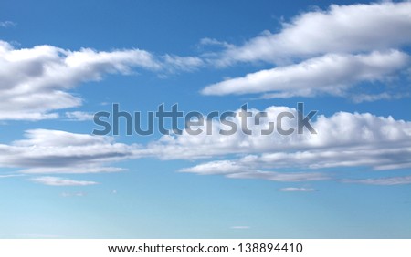 Bright cloudy blue sky horizontal background texture
