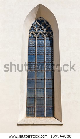Tall Gothic window on church wall in old part of Tallinn, Estonia