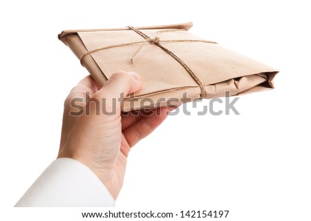 Male hand delivers full envelope tied with a rope isolated on white background