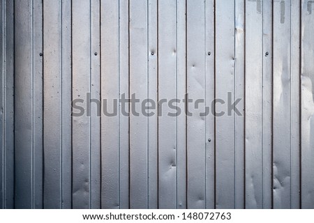 Shining ridged metal fence. Background photo texture