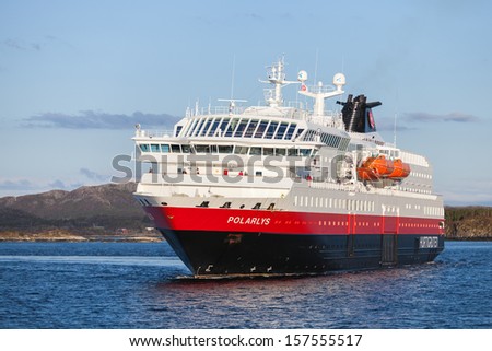RORVIK, NORWAY - MAY 11: Norwegian passenger cruise ship MS Polarlys enters the port of Rorvik on May 11, 2013. MS Polarlys was built in 1996, name Polarlys is the Norwegian word for polar light