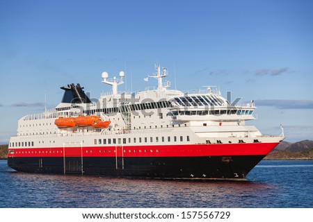 Big Norwegian passenger cruise ship goes on fjord