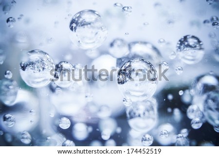 Abstract blue photo background with bubbles in glass sphere