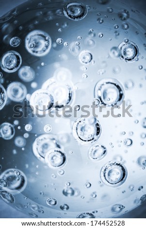 Abstract blue vertical background with bubbles in glass sphere