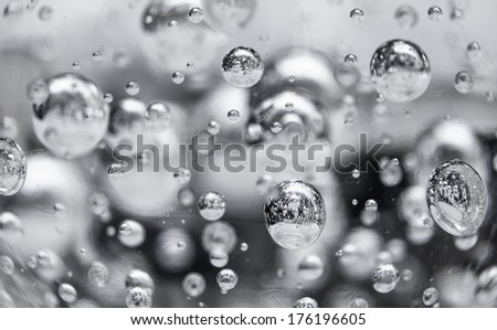 Abstract black and white photo background with bubbles in glass sphere