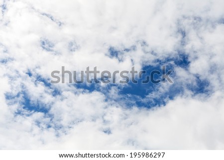 White cloudy sky with blue areas. Background photo texture