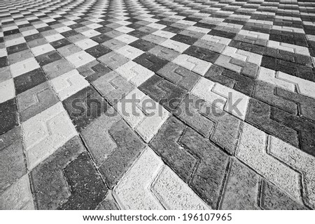 Black gray and white pattern of urban cobblestone pavement