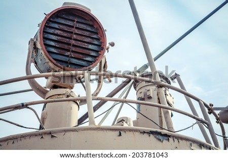 Rusted signal light mounted on captain bridge of an old ship