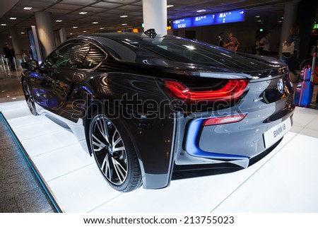 FRANKFURT, GERMANY - AUGUST 28, 2014: Photo of black BMW series i8 innovation car. Advertising stand in the passenger terminal, airport of Frankfurt
