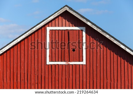 Classical Scandinavian architecture fragment, red wooden house wall