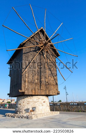 Ancient wooden windmill on the sea coast, the most popular landmark of old Nessebar town, Bulgaria