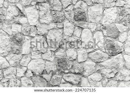 Seamless background texture of white old stone wall