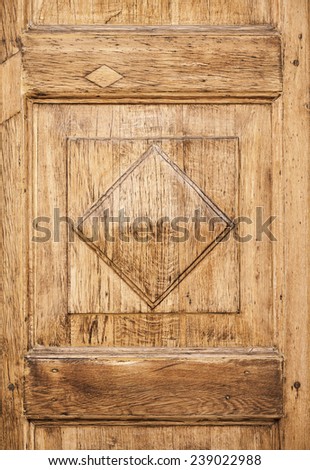 Old wooden decorative panel pattern on the door