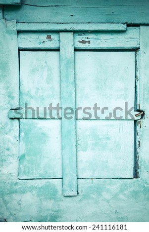 Green rural metal wall  with locked window