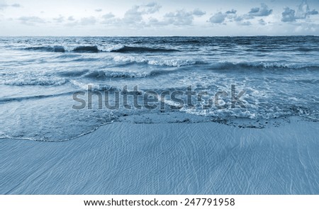 Landscape of Atlantic ocean coast. Dominican republic, Punta Cana. Blue toned photo filter effect