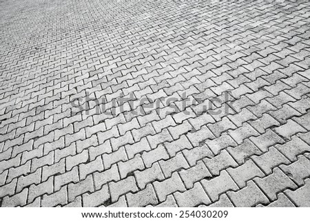 Abstract urban background texture of modern gray cobblestone road pavement