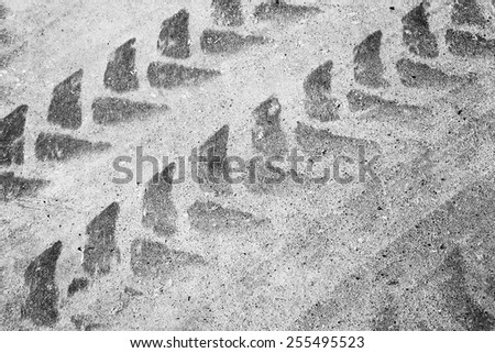 Abstract asphalt road fragment with tire track pattern, automotive transportation background