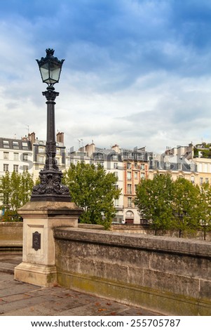 Street lamp of Pont Neuf, the oldest bridge across the Seine river in Paris, France