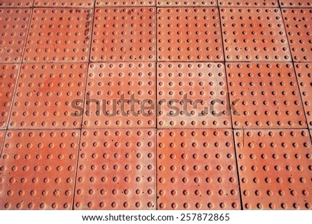 Abstract red pavement, industrial panels background texture