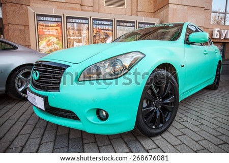 Saint-Petersburg, Russia - April 11, 2015: Infinity fx 37 car with green matte paintings stands parked on the street