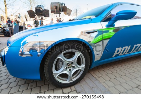 Saint-Petersburg, Russia - April 11, 2015: Blue Afla Romeo Brera car with silver paintings lines and police text label