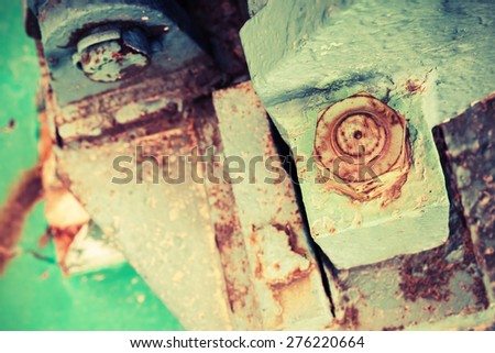 Old rusted industrial details, nuts and bolt, selective focus, shallow DOF, vintage toned photo with old instagram style filter effect