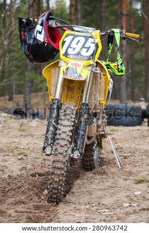 Saint-Petersburg, Russia - April 13, 2014: Yellow motocross bike stands on the dirty track road