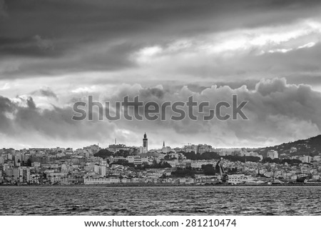 Stormy cloudy sky over Tangier city, Morocco. Black and white photo filter effect