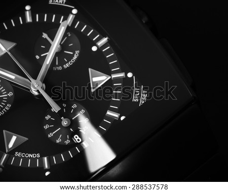 Luxury mens Chronograph Watch made of black high-tech ceramics with sapphire glass. Close-up studio photo with selective focus