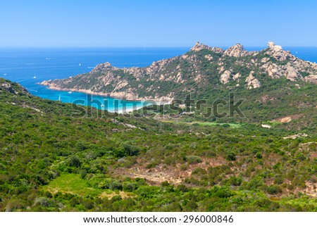 Corsica, coastal landscape with mountains and beach. Mediterranean Sea coast, France