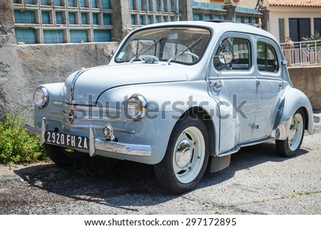 Ajaccio, France - July 6, 2015: Light blue Renault 4CV old-timer economy car stands parked on a roadside in French town