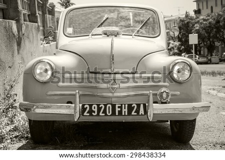 Ajaccio, France - July 6, 2015: Renault 4CV old-timer economy car stands parked on a roadside in French town, front view