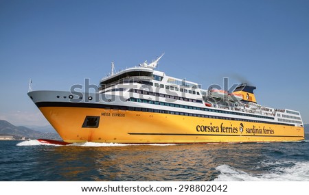 Ajaccio, France - June 30, 2015: The Mega Express ferry, big yellow passenger ship operated by Corsica Ferries Sardinia Ferries shipping company goes on the Mediterranean Sea