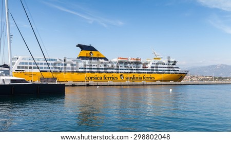 Ajaccio, France - June 29, 2015: The Mega Express ferry, big yellow passenger ship operated by Corsica Ferries Sardinia Ferries shipping company moored in Ajaccio port