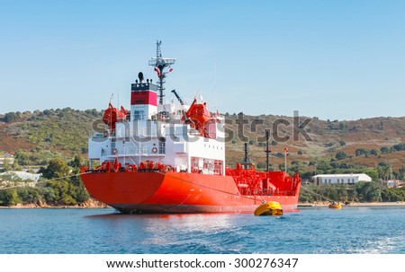 Red Liquefied Petroleum Gas LPG tanker with white superstructure stands moored in Port of Ajaccio, Corsica, France