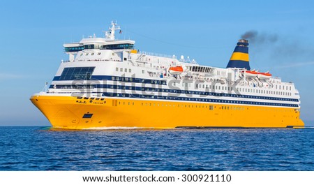 Yellow passenger ferry goes on the Mediterranean Sea