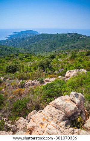South Corsica, vertical coastal landscape with long cape going to the horizon over Mediterranean Sea water